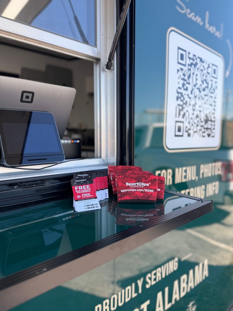 Food truck service window with the order screen and a QR code for the menu