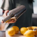 Lemonade shaker with fresh lemons
