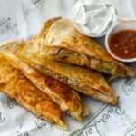 Quesadilla wedges with salsa and sour cream