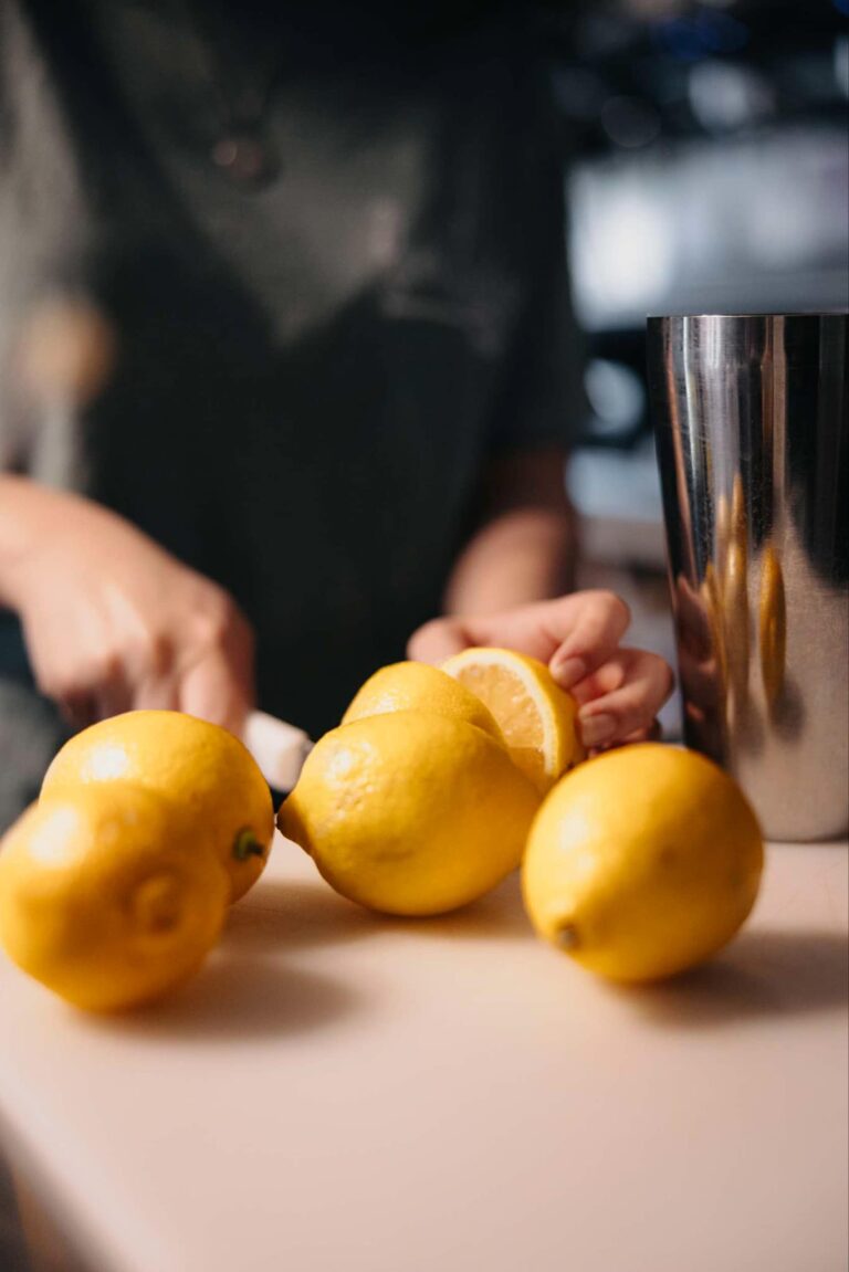 Slicing fresh lemons for lemonade